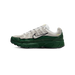 Side view of a left Nike P-6000 sneaker with grey suede upper, dark green leather midsole and toe overlay, chunky green outsole, and white Nike swoosh outlined in black.