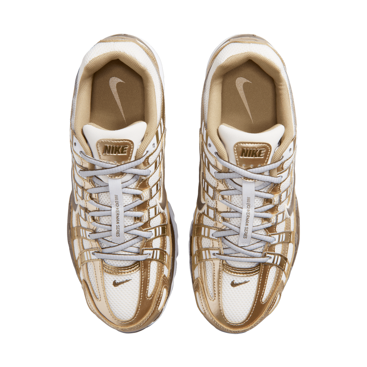 Top-down view of a pair of Nike P-6000 sneakers in white and metallic gold with tan insoles and crisscrossing white laces.