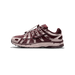 A single Nike P-6000 sneaker in burgundy and light taupe, shown from the outside with the toe pointing left, displaying the Swoosh logo and P-6000 branding on the side and a visible bungee-style lace system.