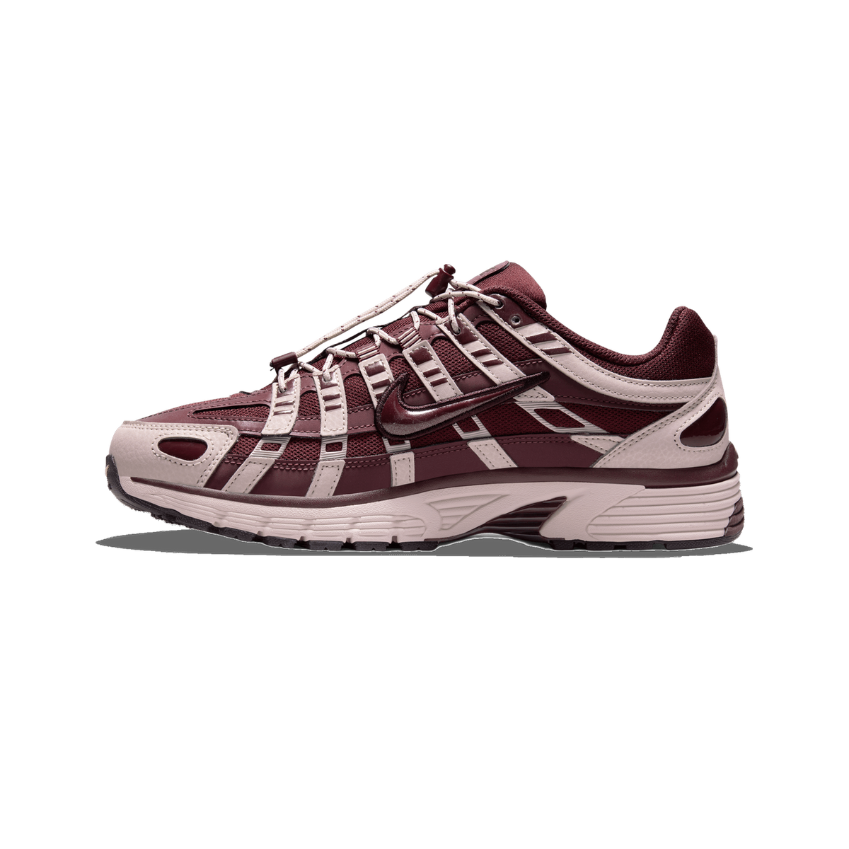 Side profile of a single burgundy Nike P-6000 sneaker with the toe pointing left, showing a dark red mesh and overlay upper, light pinkish-beige synthetic panels, a bungee-style lace system, and the Swoosh logo on the side.