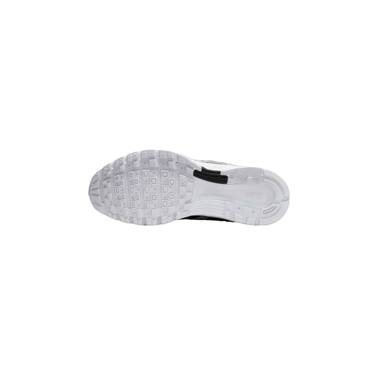 Bottom view of a white Nike P-6000 sneaker showing the textured outsole tread pattern and Nike logo near the heel
