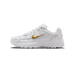 Side view of a white Nike P-6000 sneaker with a metallic gold Swoosh logo on the midfoot, gold 'P-6000' text on the heel, and a white mesh and synthetic upper with a chunky white sole, toe pointing left.