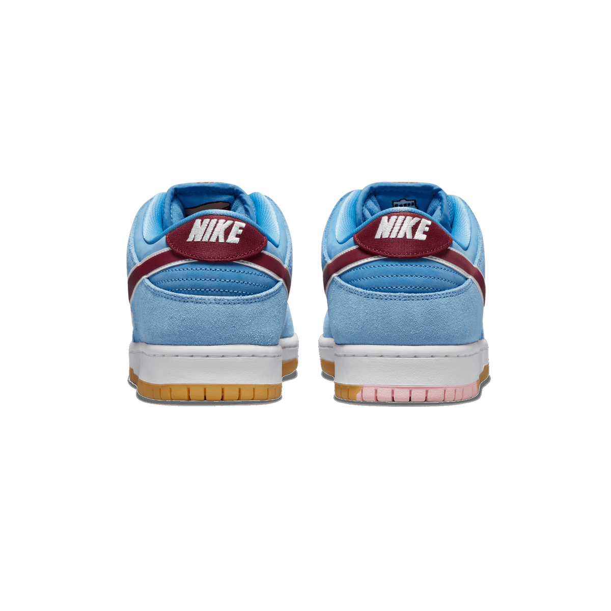 Rear view of a pair of light blue suede Nike SB Dunk Low sneakers with maroon heel tabs reading Nike and white midsoles on gum outsoles.