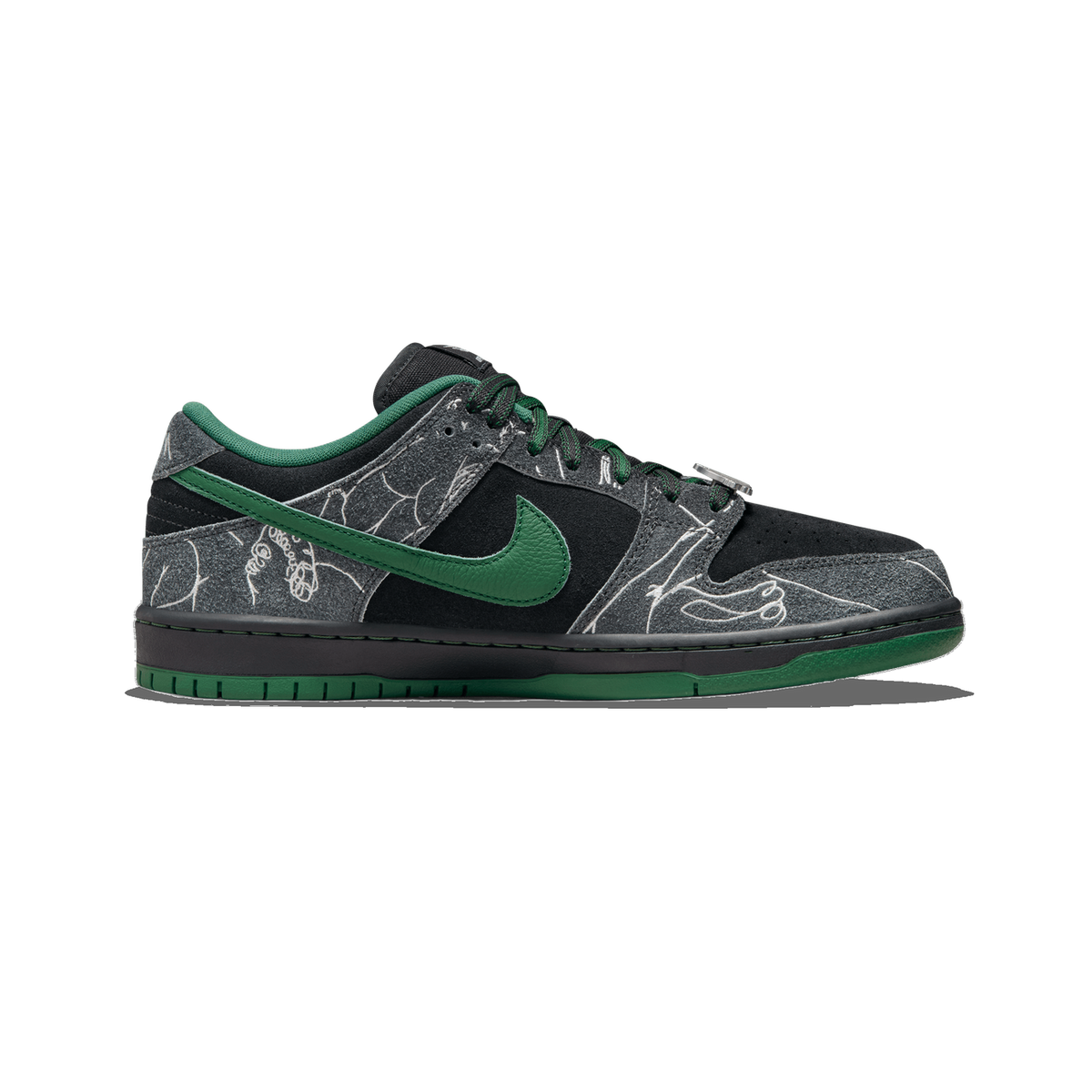 Side view of a black and grey Nike SB Dunk Low with green swoosh, lace charm, hand-drawn line art graphics, and a green outsole, toe pointing left.