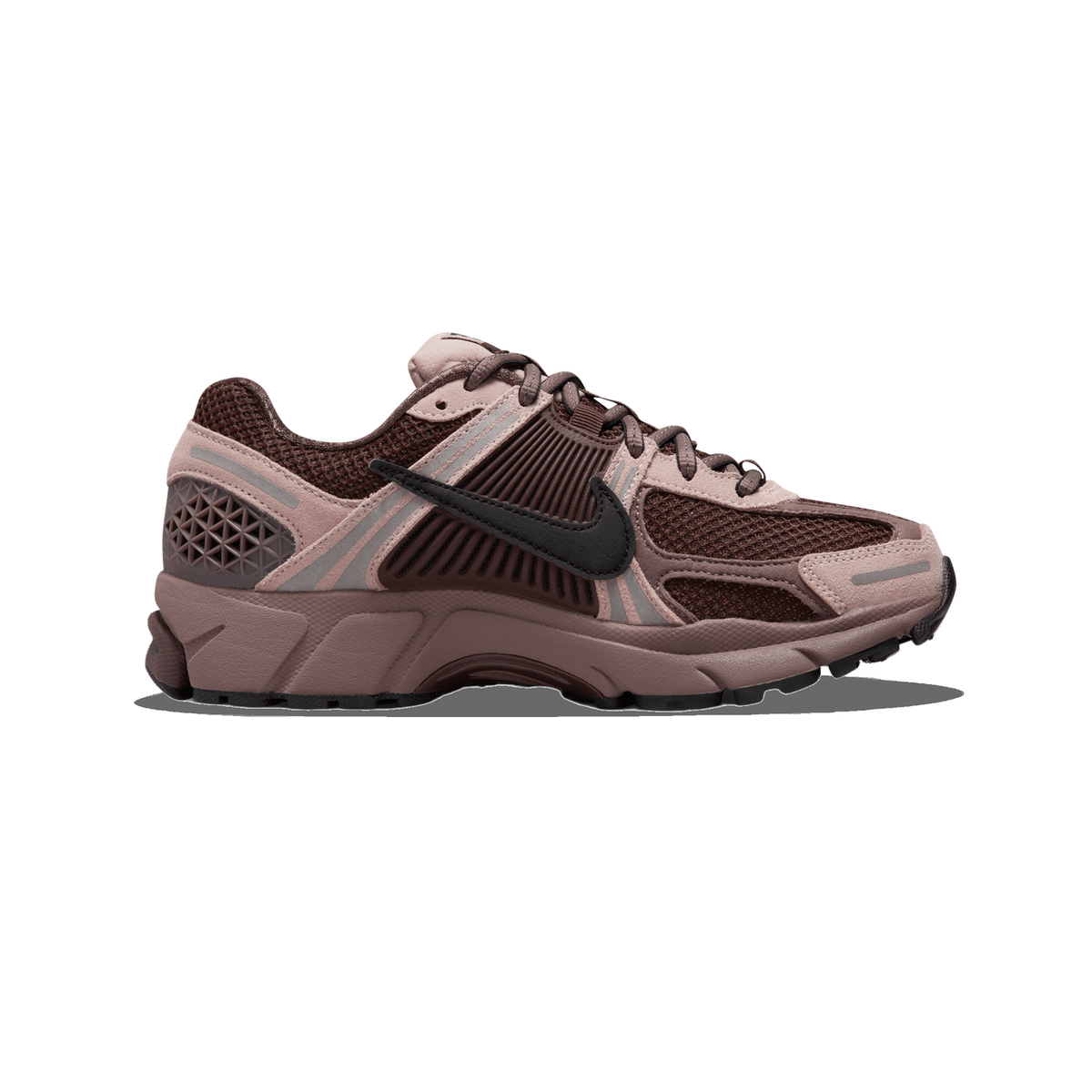 A single brown and mauve Nike Zoom Vomero 5 sneaker shown from the outside, toe pointing left, with a black Swoosh logo on the side panel and brown mesh upper.