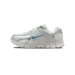 Side view of a white and silver Nike Zoom Vomero 5 running shoe with a light blue Swoosh and chunky ridged outsole, toe pointing left