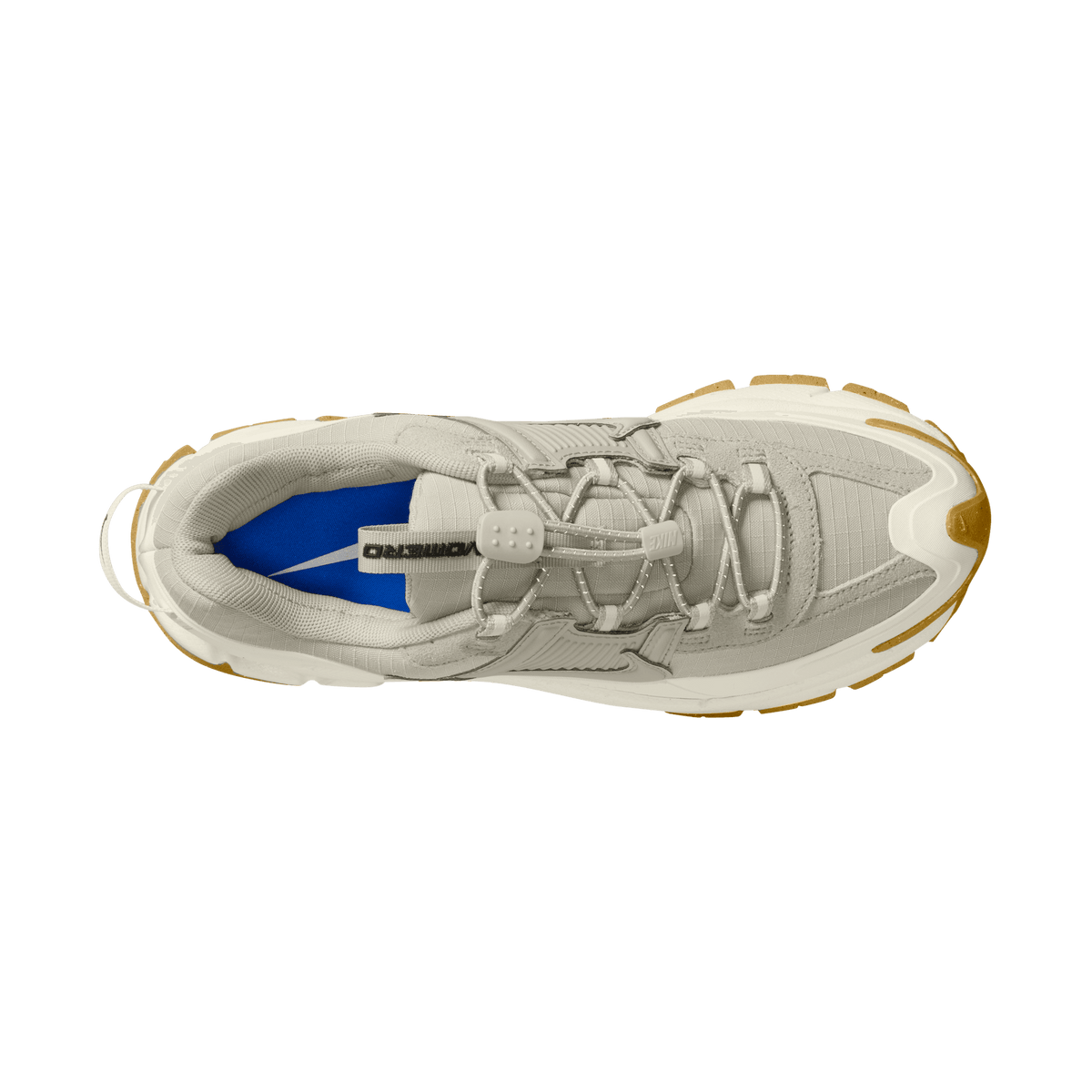 Top-down view of a light stone grey Nike Zoom Vomero 5 sneaker with gum outsole and blue interior lining visible at the heel opening