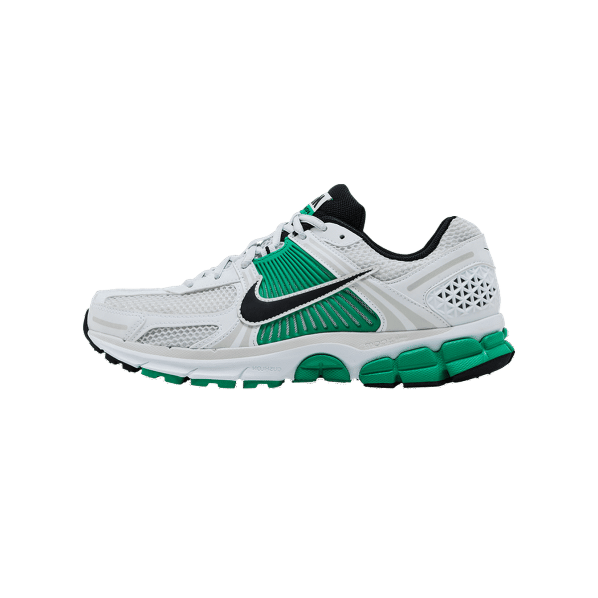 Left Nike Zoom Vomero 5 sneaker shown from the side with toe pointing left, featuring a white mesh upper, green overlays, black Swoosh and heel tab, and a white and green chunky outsole.