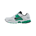 Left Nike Zoom Vomero 5 sneaker shown from the side with toe pointing left, featuring a white mesh upper, green overlays, black Swoosh and heel tab, and a white and green chunky outsole.