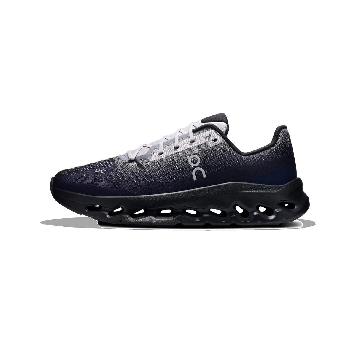 Side view of a navy On Cloudtilt sneaker with light grey laces and heel tab, featuring a black perforated CloudTec Phase sole.