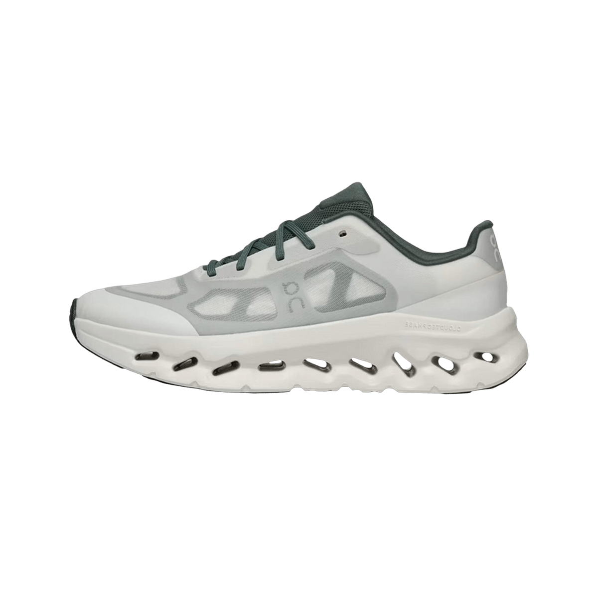 Side view of an ivory and olive green On Running Cloudtilt sneaker with a perforated CloudTec sole and green laces and heel panel.