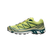 Side view of a lime green Salomon XT-6 trail shoe with dark teal overlays, white midsole, black lugged outsole, and toggle lacing, toe pointing left.