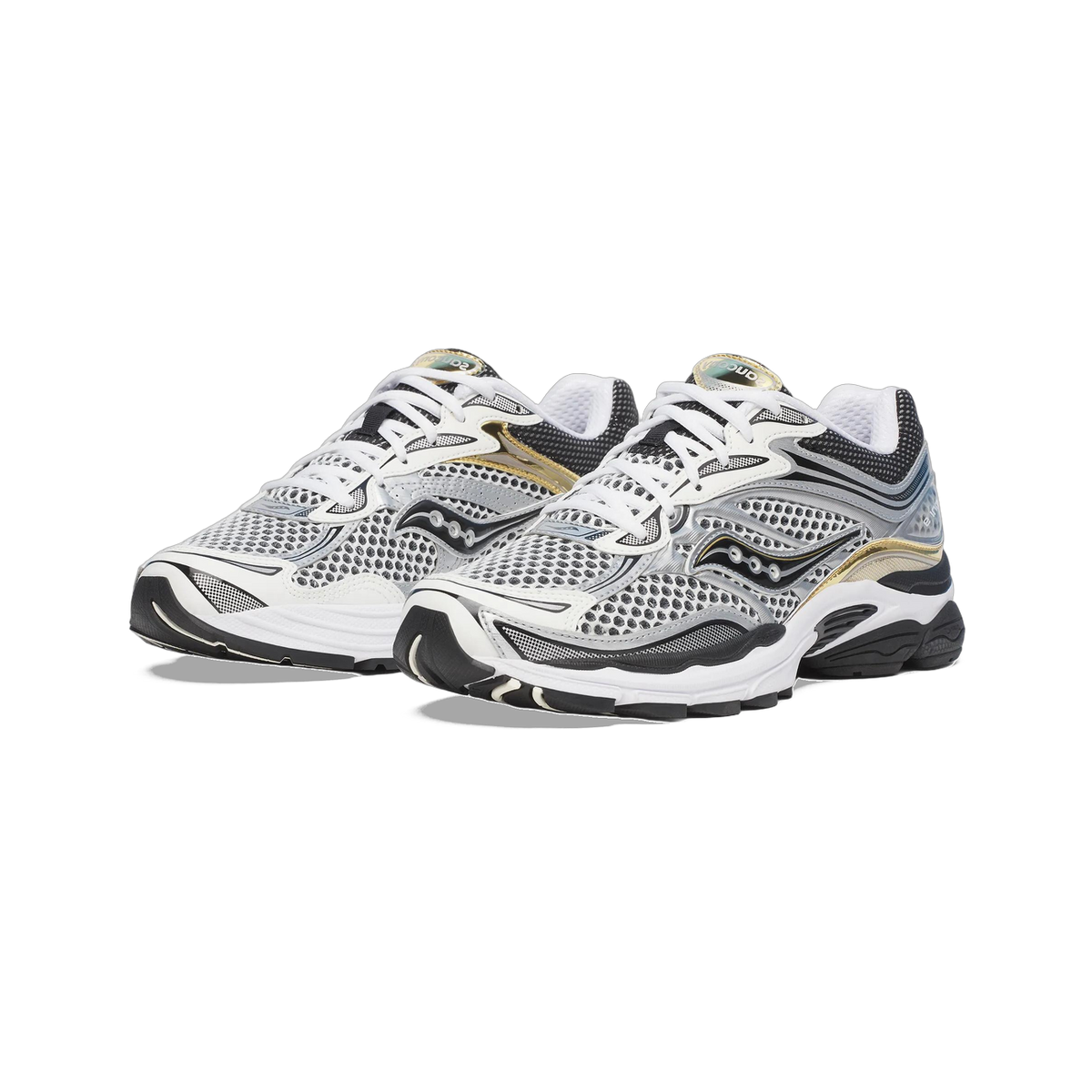 Pair of Saucony ProGrid Omni 9 sneakers in white, silver, black and gold, shown angled toward the front with mesh uppers and chunky white and black midsoles.