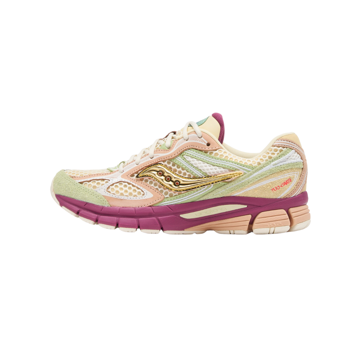 Side view of a Saucony ProGrid Guide 7 sneaker with cream mesh upper, sage green suede accents, peach overlays, gold metallic Saucony logo, and a magenta midsole.