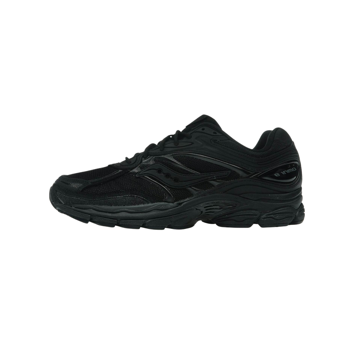 Side view of a black Saucony ProGrid Omni 9 running shoe with toe pointing left, showing mesh upper, layered overlays, and chunky midsole with visible Omni 9 branding