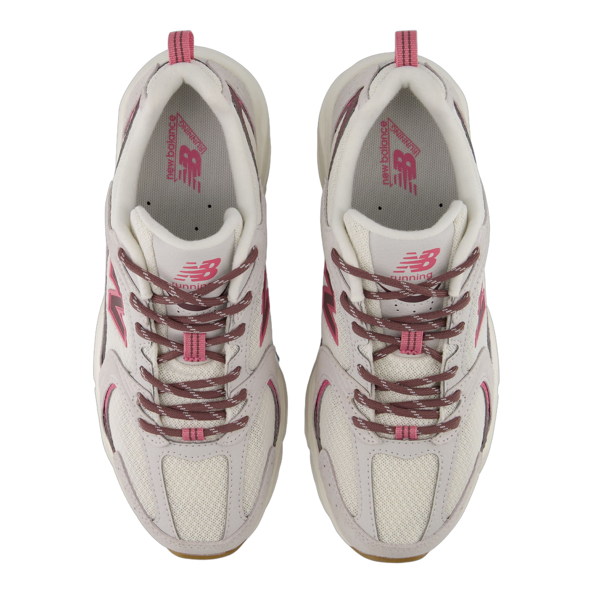 Top-down view of a pair of New Balance U5302V3 sneakers in grey with pink accents and mauve laces, showing the New Balance branding on both tongues.