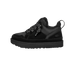 Side view of a black UGG Lowmel shoe with black and white patterned laces, a thick platform sole, and the UGG logo embossed on the heel.