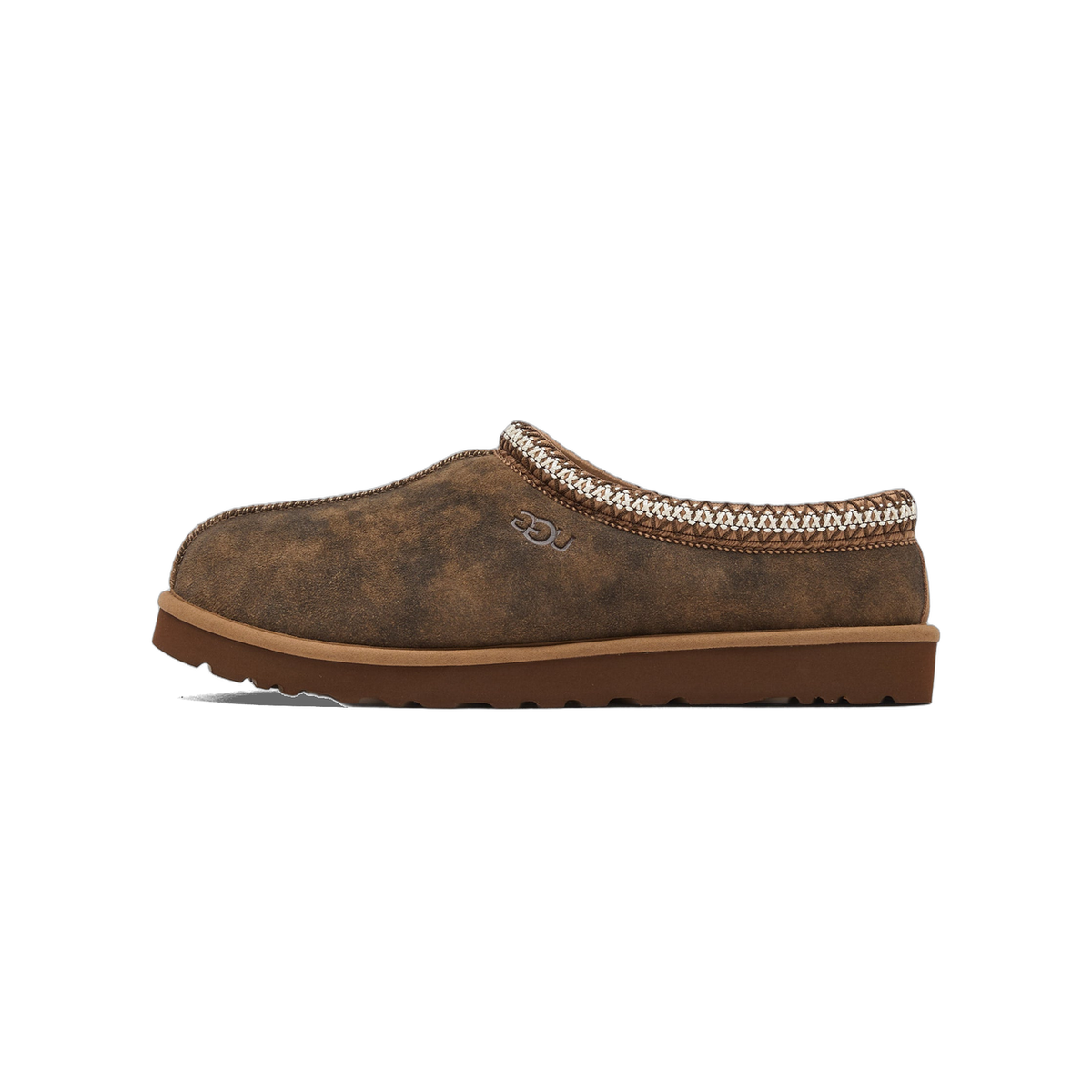 Side view of a brown suede UGG Tasman slipper with embroidered braid trim and UGG logo on the heel, toe pointing left.