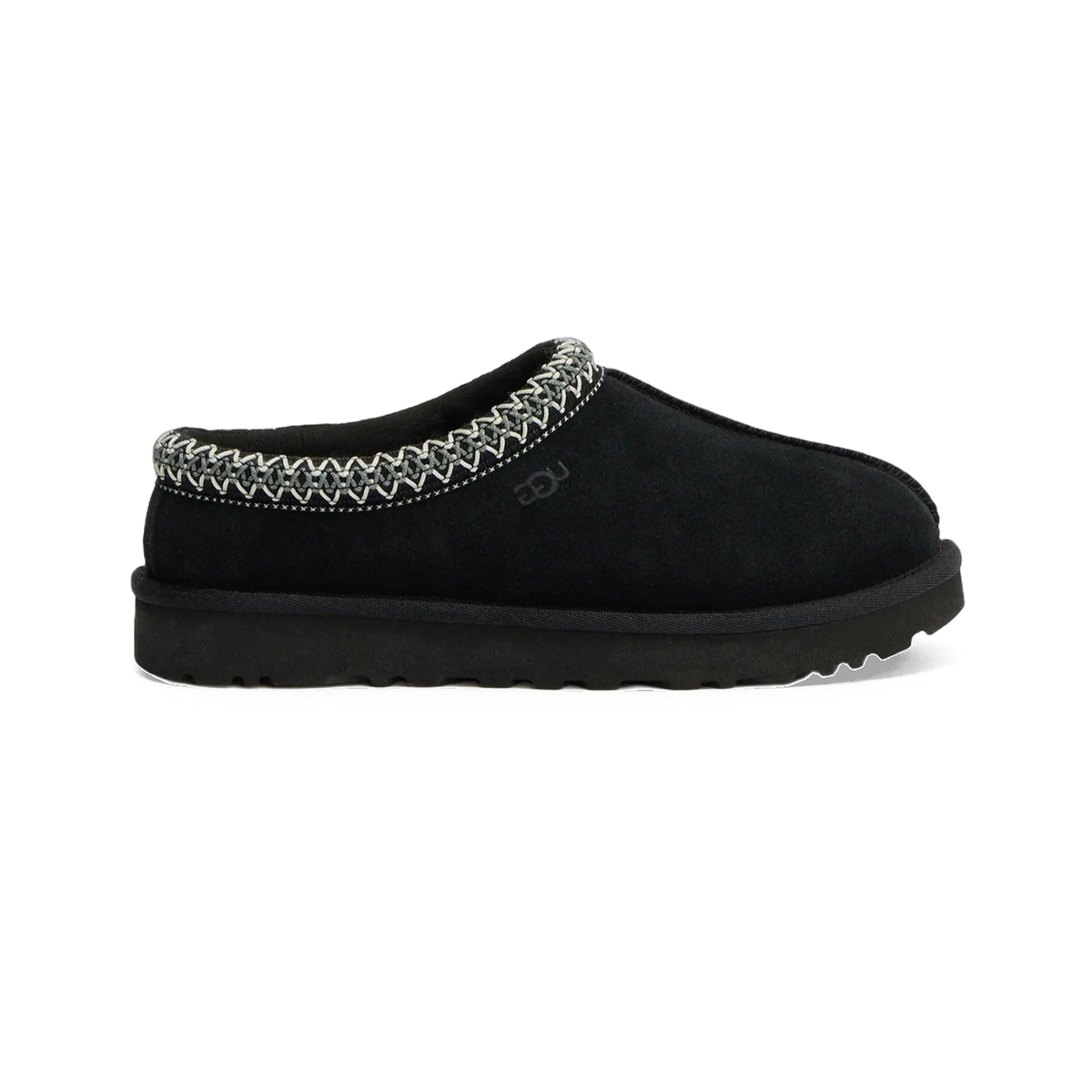 Side view of a black UGG Tasman II slip-on slipper with embroidered trim around the collar and a black rubber sole.