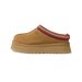 Side view of a chestnut brown suede UGG Tazz II slipper with a platform sole and red-and-cream embroidered trim around the collar.