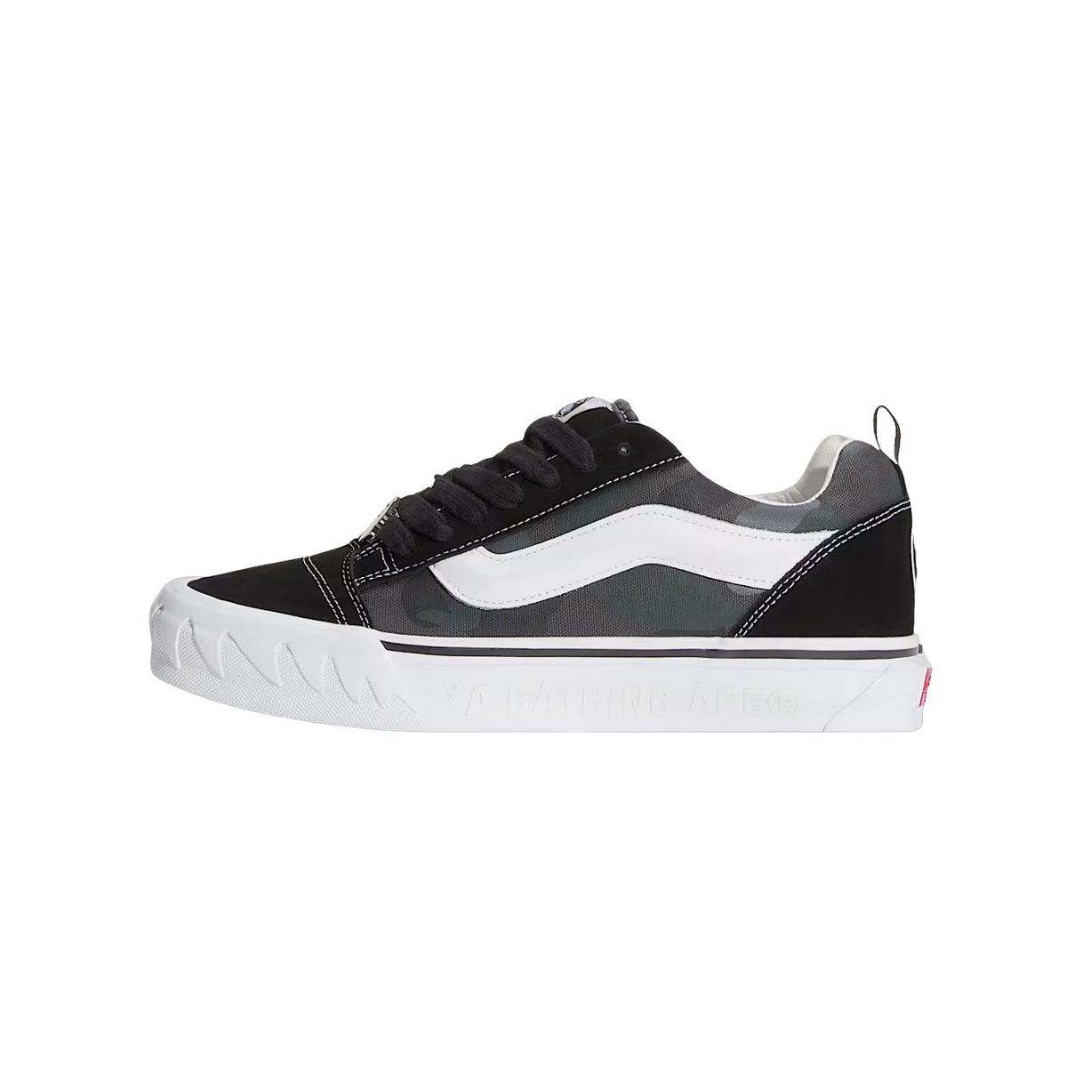 Side view of a black and green camouflage Vans Knu Skool sneaker with white side stripe and black laces, featuring embossed BAPE text on the white midsole.