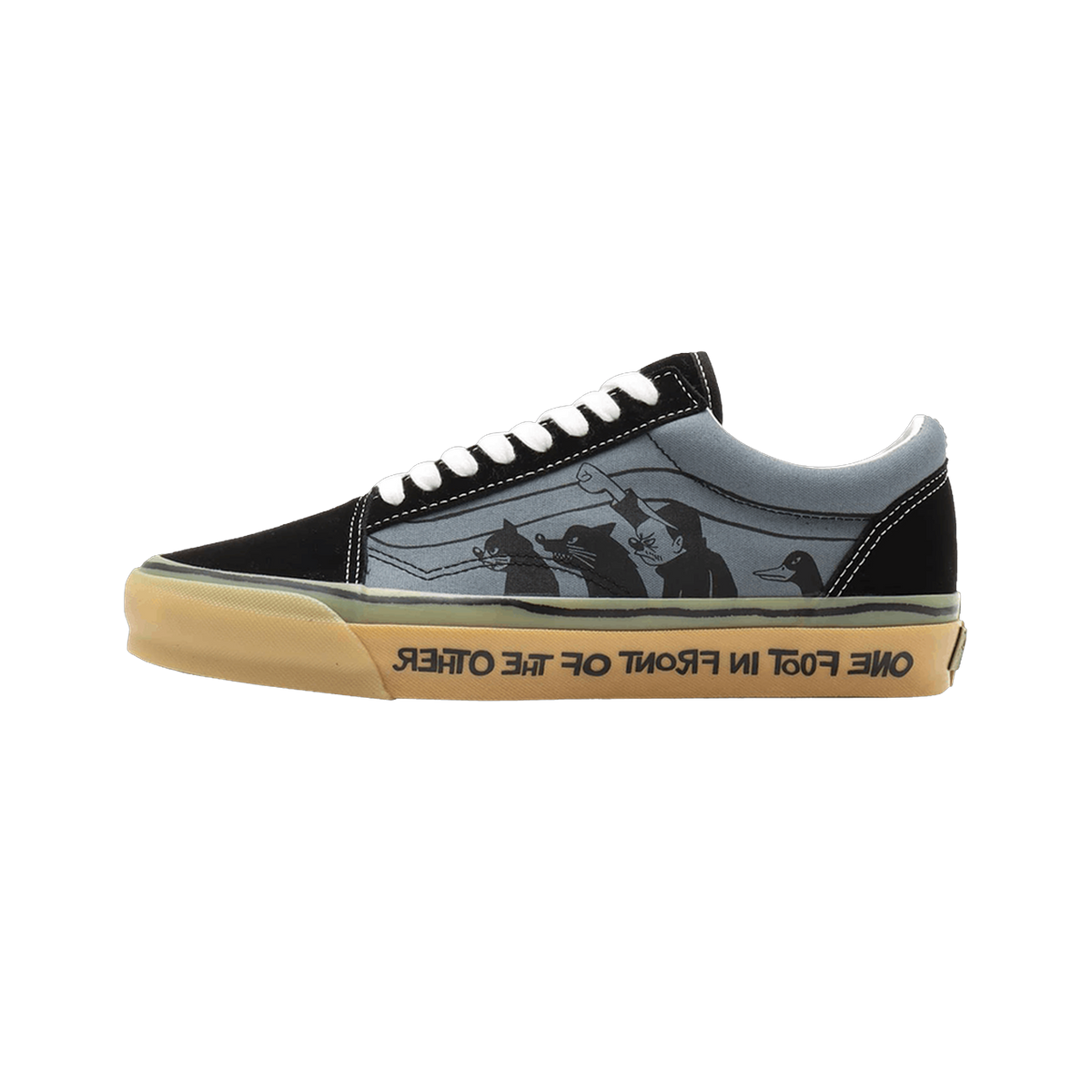 Side view of a black and grey Vans Old Skool sneaker with a printed cartoon graphic of animal characters and a gum sole reading 'one foot in front of the other'.