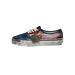 Side view of a Vans Authentic sneaker with a navy toe and heel, red and silver sequined sidewall, distressed splattered midsole, and metal charms hanging from the laces