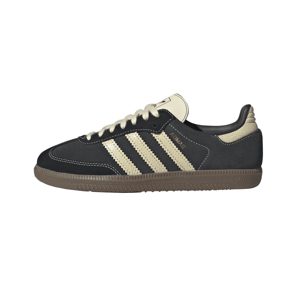 Side view of a black suede Adidas Samba OG sneaker with cream leather three stripes, heel tab, and tongue, gum rubber outsole