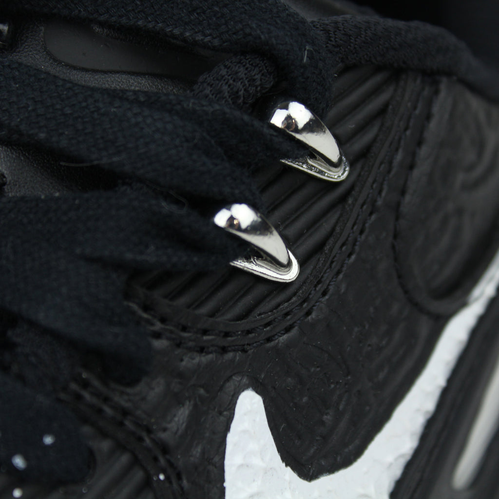 Slawn × Nike Air Max 90 “Black” with speckled paint, white Swoosh and metallic details. March/April 2025 release. Shop now at The Attic!