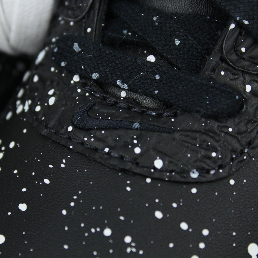 Slawn × Nike Air Max 90 “Black” with speckled paint, white Swoosh and metallic details. March/April 2025 release. Shop now at The Attic!