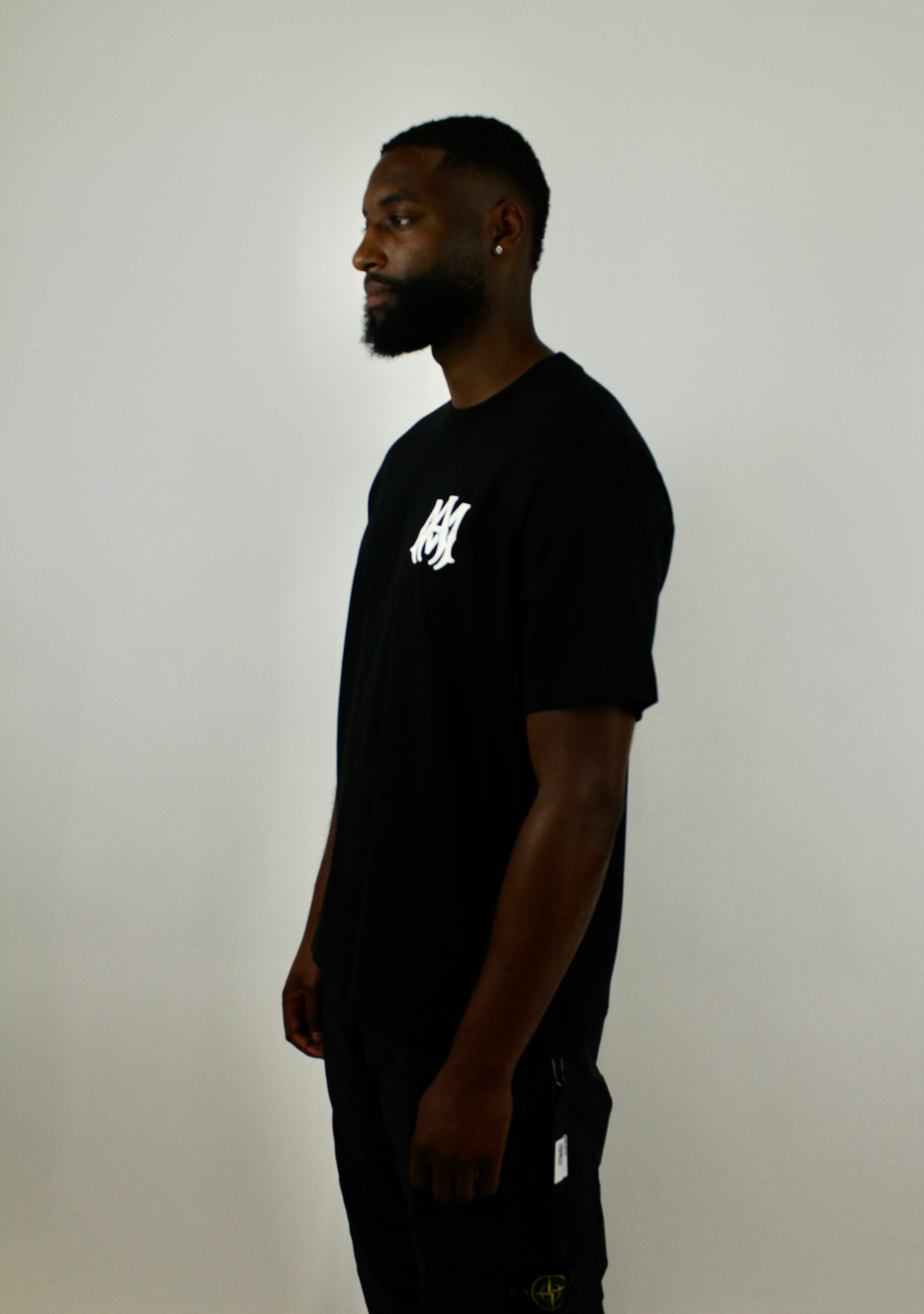Amiri Core Logo Tee 'Black' – sleek black T-shirt with the signature Amiri core logo, premium soft cotton fabric, and minimalist style, ideal for everyday casual and streetwear looks.