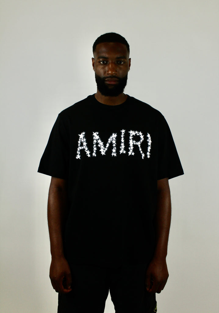 Amiri Stars Logo Tee 'Black' – stylish black t-shirt featuring the iconic Amiri star logo, premium soft cotton fabric, and minimalist design, perfect for casual and streetwear outfits.