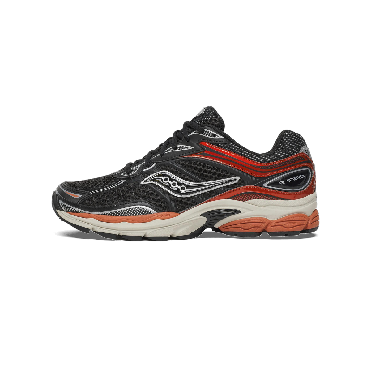 Side profile of a black Saucony Omni 9 running shoe with red-orange overlays, silver accents, a cream midsole, and an orange SRC outsole, with the toe pointing right.