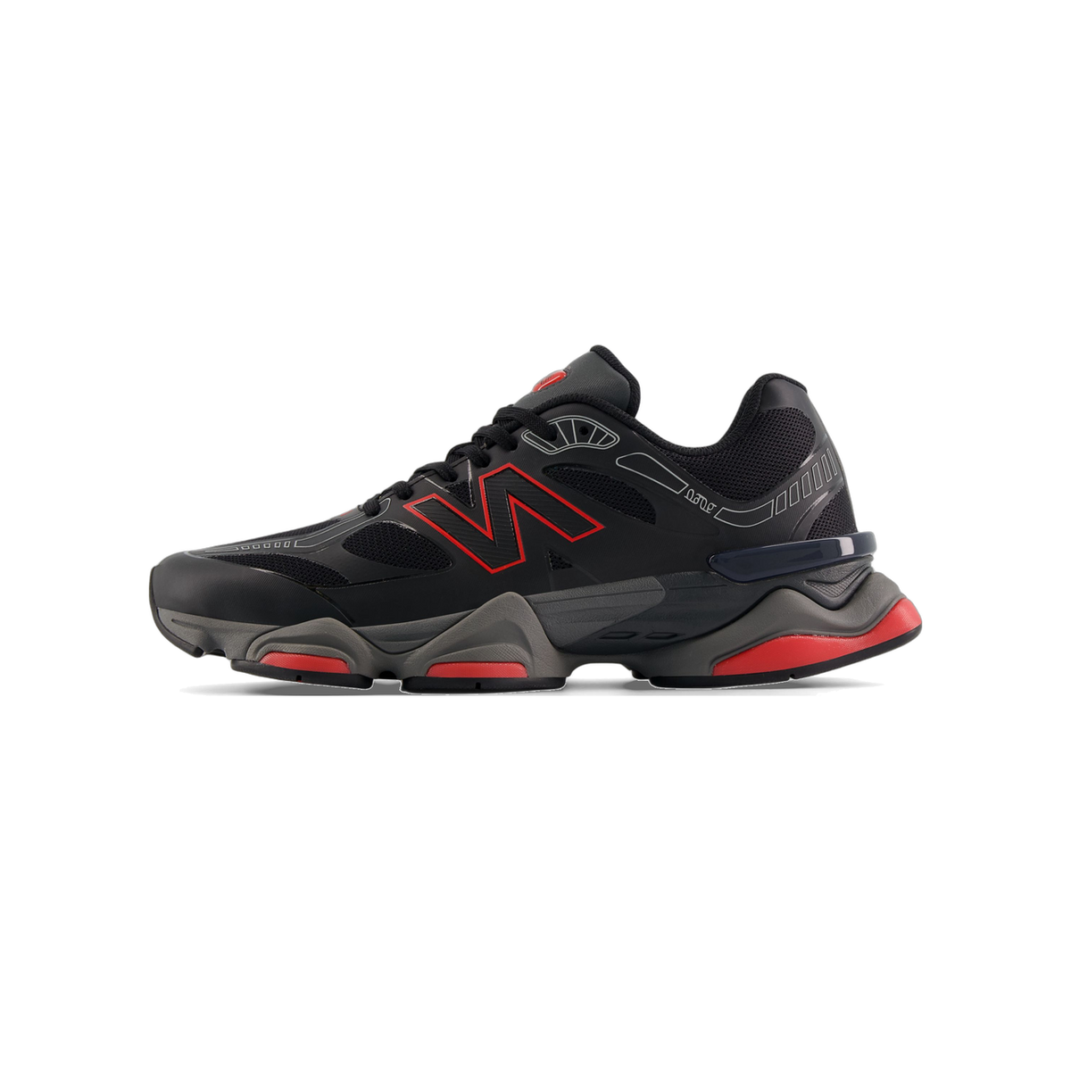 Side view of a black New Balance 9060 sneaker with red N logo, red midsole accents, and a grey chunky outsole, toe pointing left.