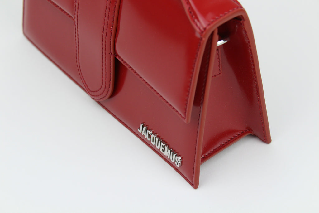 Jacquemus Le Grand Bambino 'Red' with bold leather, clean structure, and gold logo detail. A sleek, versatile statement bag for everyday elevated looks.