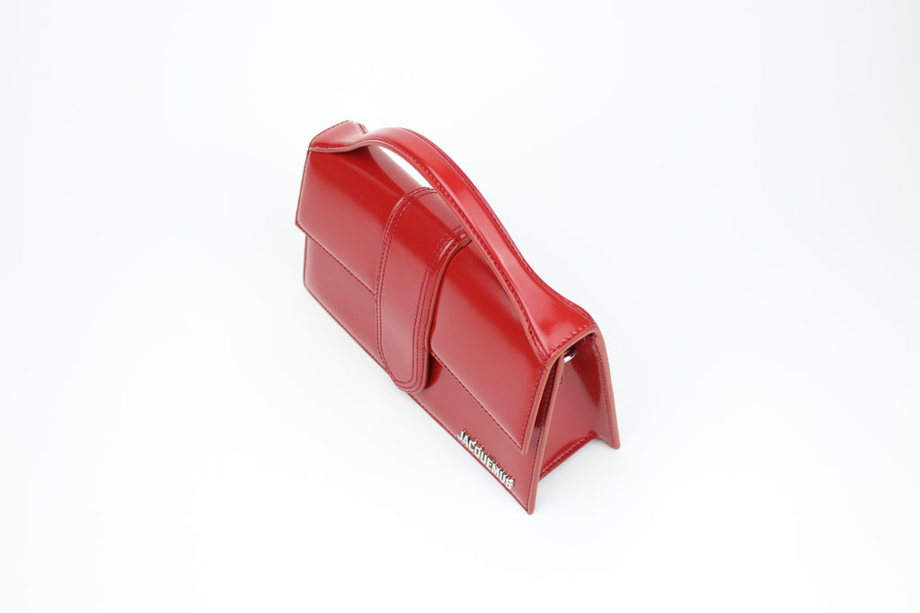 Jacquemus Le Grand Bambino 'Red' with bold leather, clean structure, and gold logo detail. A sleek, versatile statement bag for everyday elevated looks.