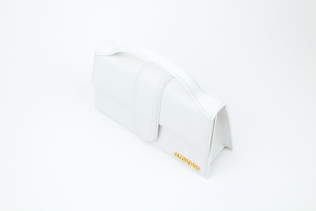 Shop the Jacquemus Le Grand Bambino 'White' – a premium leather handbag with a structured silhouette, spacious interior, and versatile design for timeless minimalist elegance.