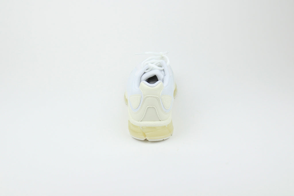 JJJJound x ASICS GEL-QUANTUM 360 White sneakers side view, minimalist design, white mesh and synthetic upper, collaborative high-performance footwear, stylish athletic shoe