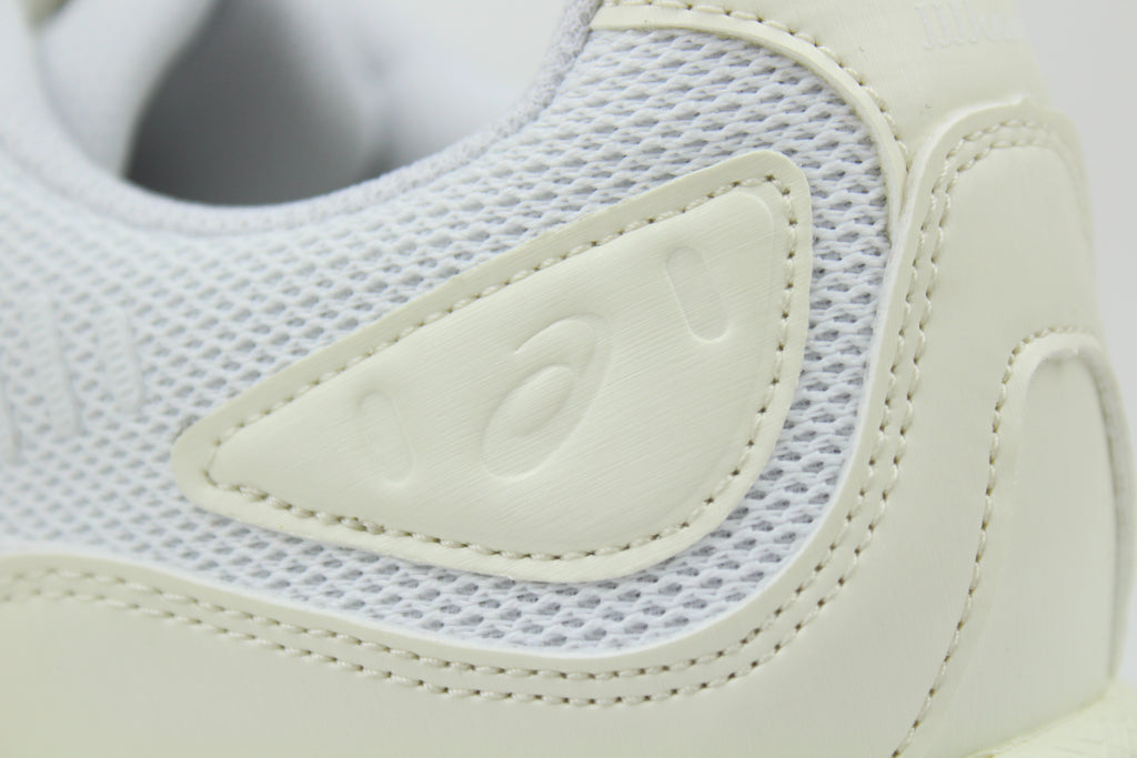 JJJJound x ASICS GEL-QUANTUM 360 White sneakers side view, minimalist design, white mesh and synthetic upper, collaborative high-performance footwear, stylish athletic shoe