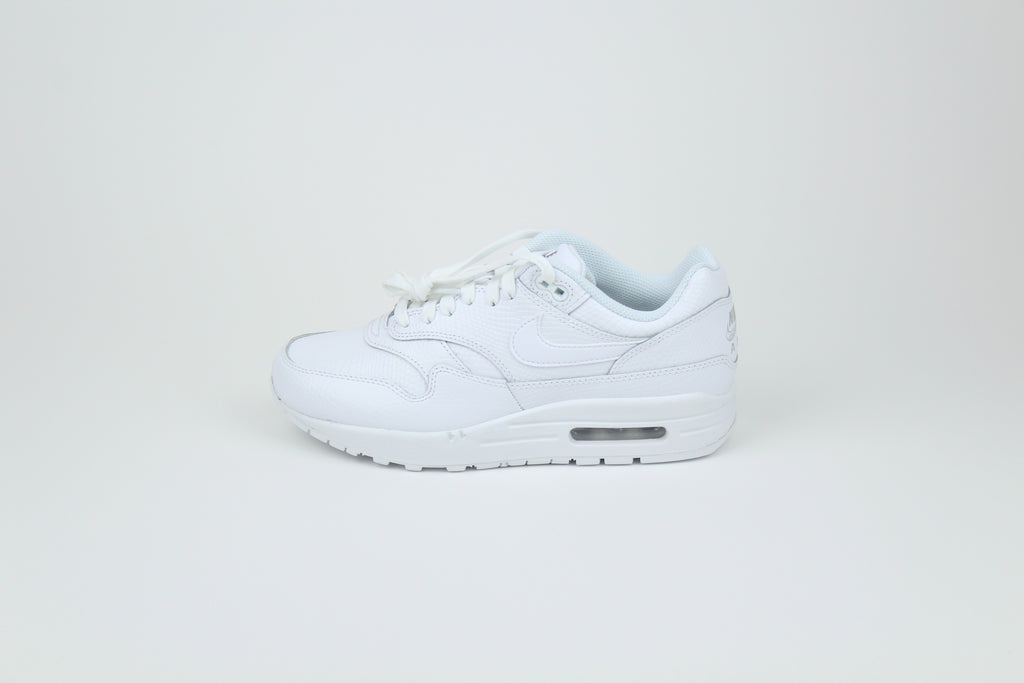 Nike Air Max 1 PRM Snakeskin sneakers in 'Triple White' colorway, premium white athletic shoes with snakeskin detailing, ideal for casual and stylish outfits.