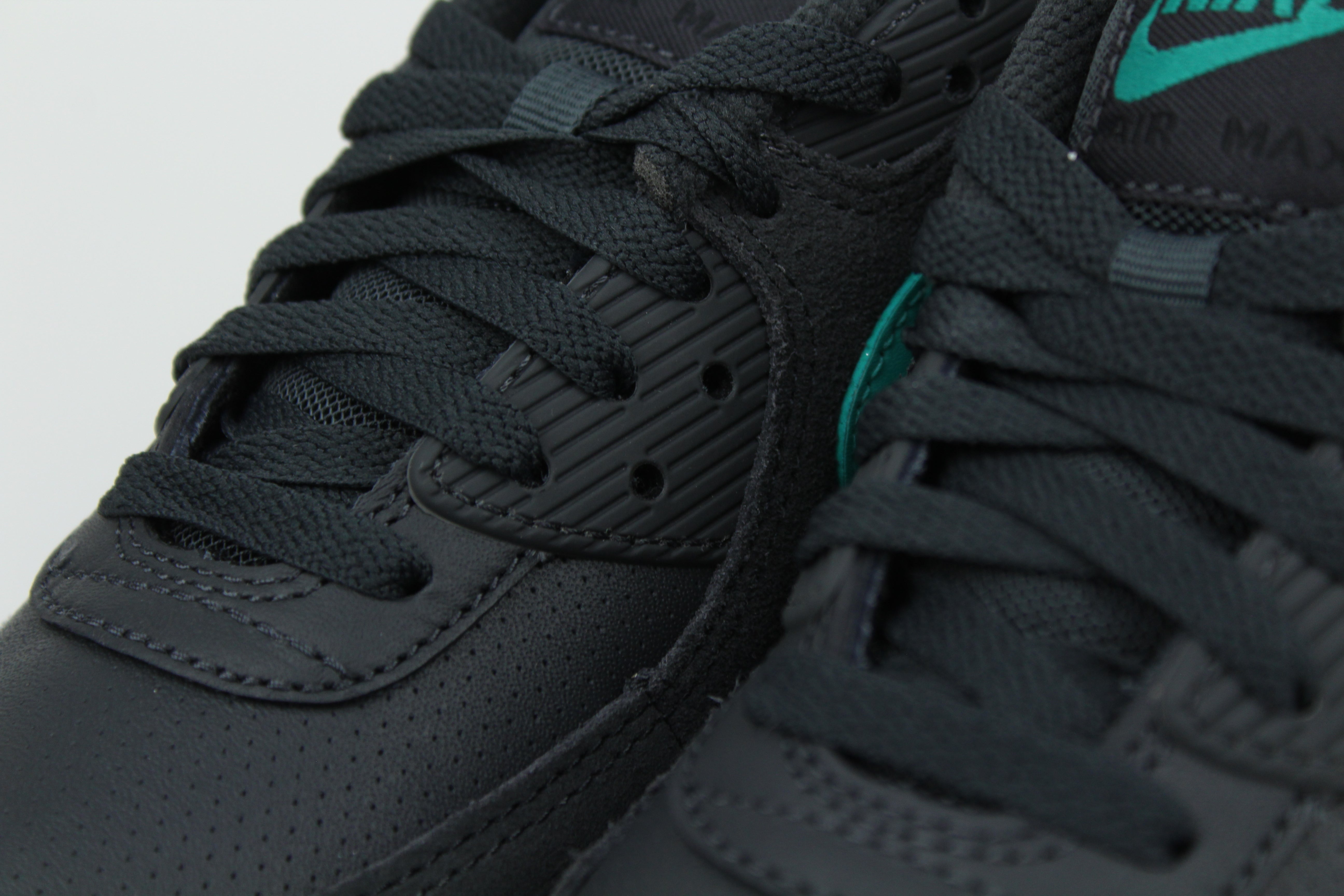 Nike Air Max 90 sneakers in 'Black Tiffany' colorway, bold black and Tiffany blue athletic shoes, perfect for casual and sporty styles.
