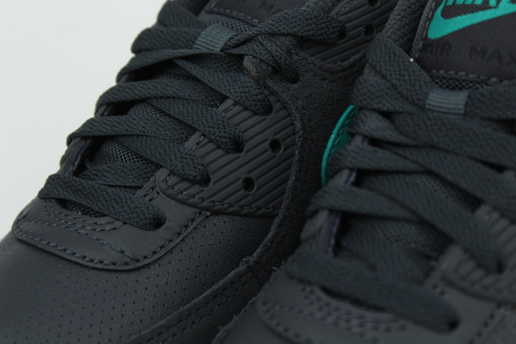 Nike Air Max 90 sneakers in 'Black Tiffany' colorway, bold black and Tiffany blue athletic shoes, perfect for casual and sporty styles.
