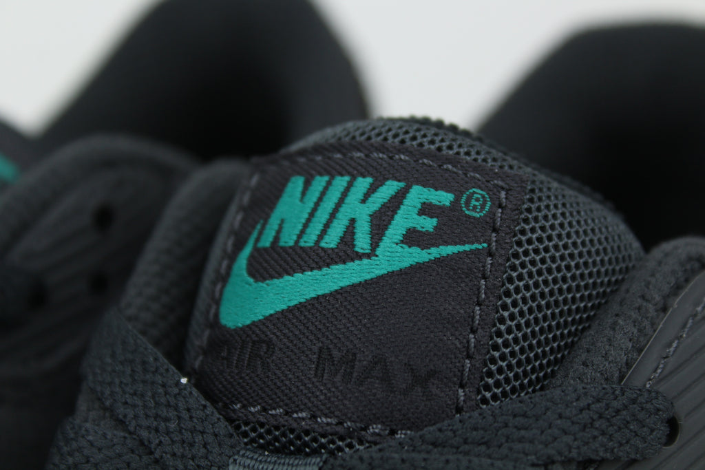 Nike Air Max 90 sneakers in 'Black Tiffany' colorway, bold black and Tiffany blue athletic shoes, perfect for casual and sporty styles.
