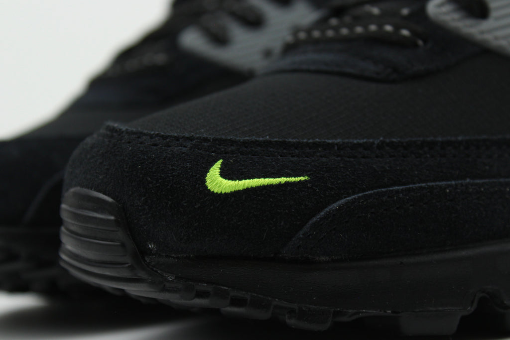 Nike Air Max 90 Black Volt sneakers with black and vibrant green colorway, featuring iconic air cushioning, breathable mesh, and durable design for performance and style