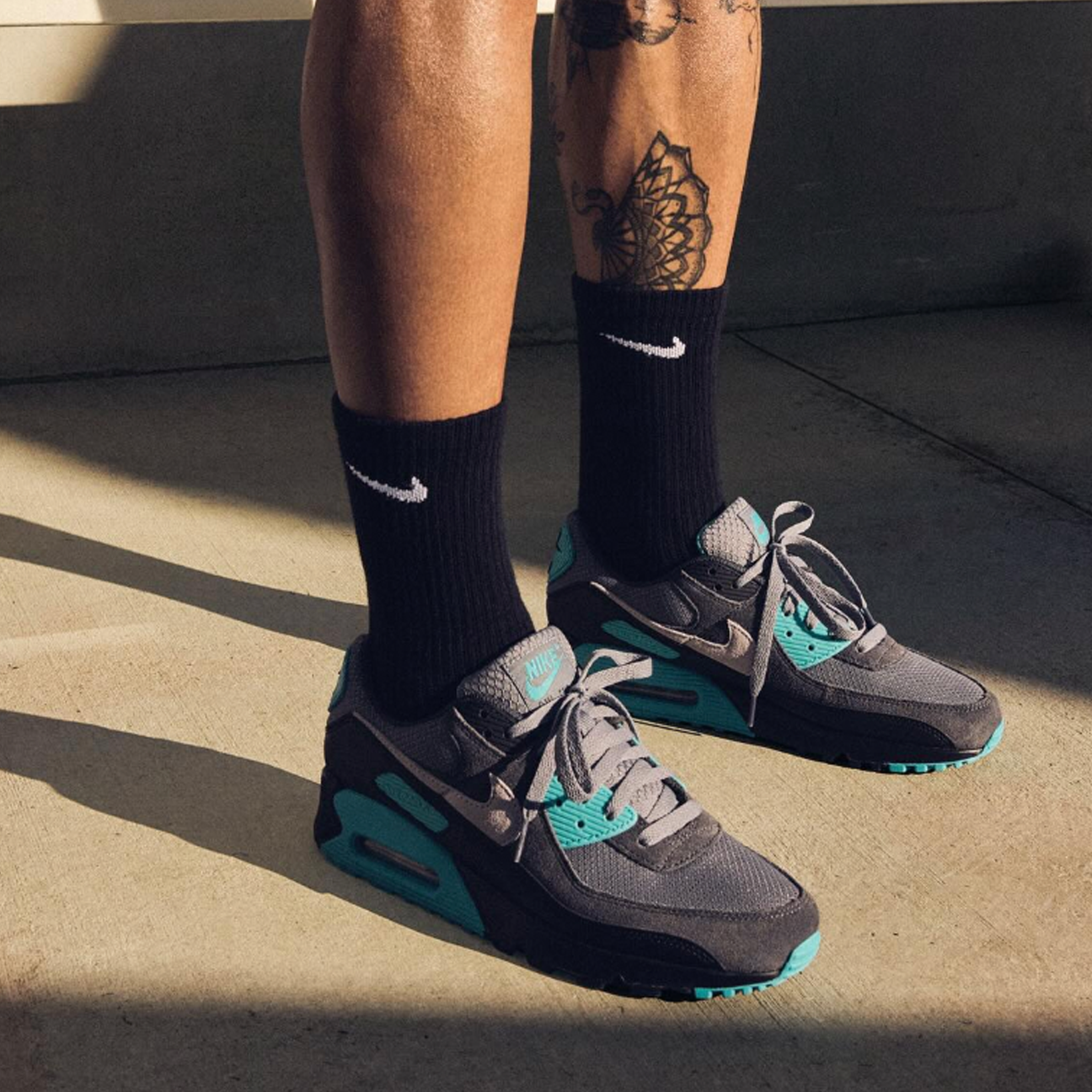 Nike Air Max 90 Cool Grey Dusty Cactus Black Wolf Grey sneaker with layered grey tones cactus accents available at The Attic
