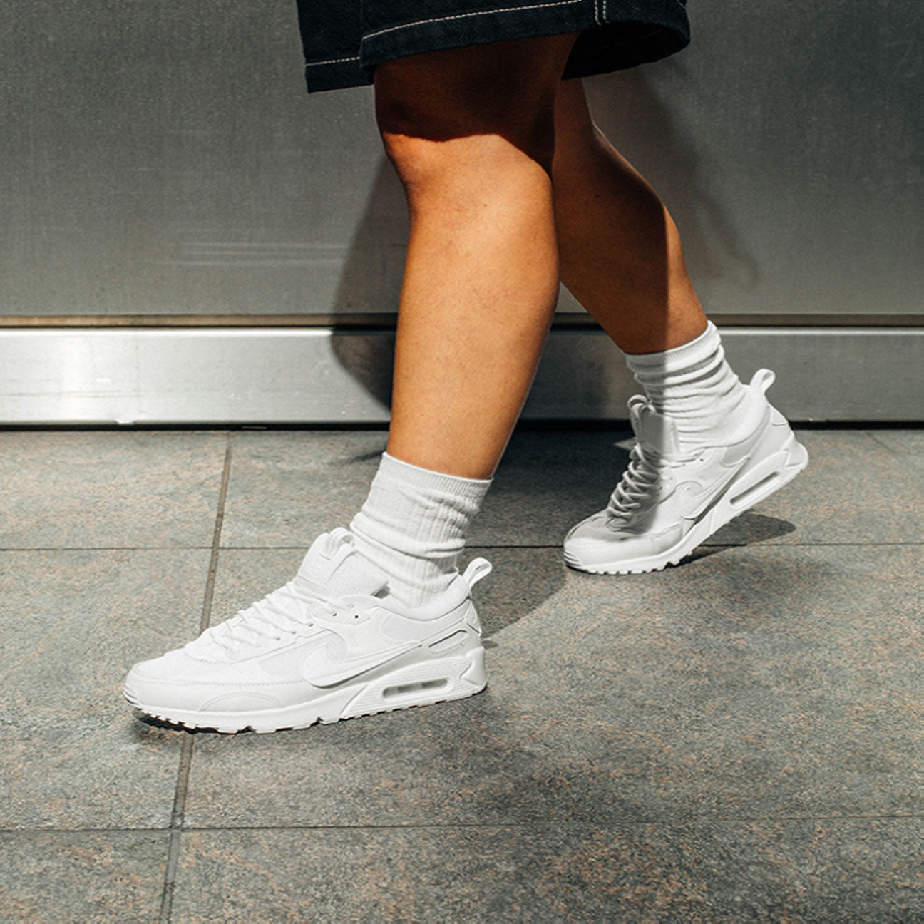 Nike Air Max 90 Futura Triple White womens sneaker with mesh and leather upper and visible Air cushioning