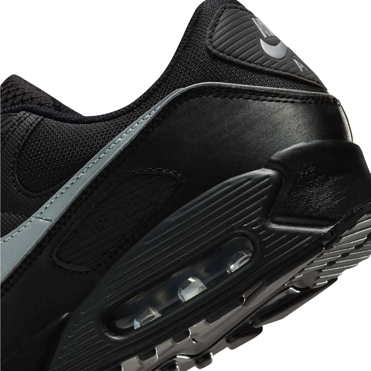 Nike Air Max 90 Premium Black Reflective sneaker with black upper reflective details and classic Air Max cushioning available at The Attic