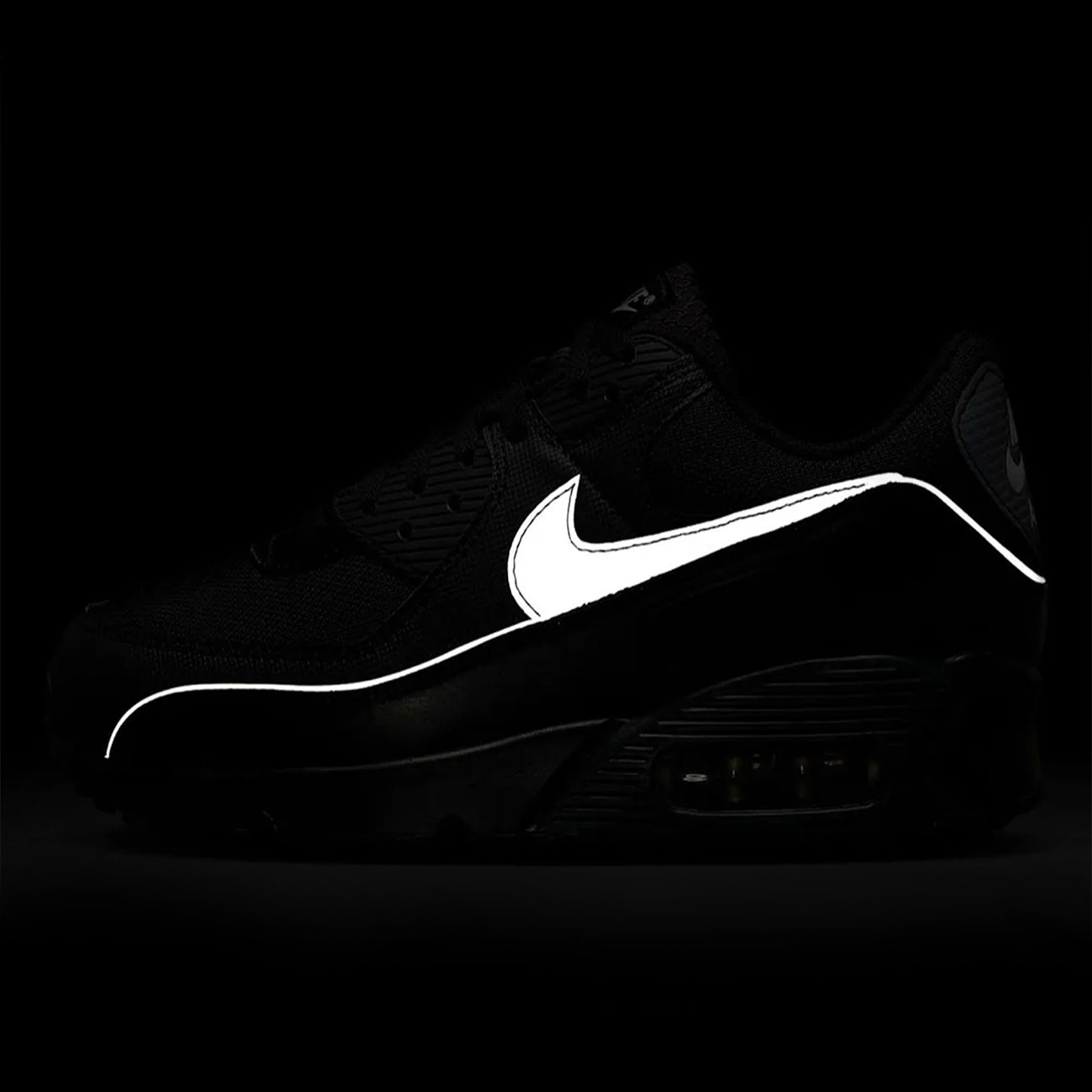 Nike Air Max 90 Premium Black Reflective sneaker with black upper reflective details and classic Air Max cushioning available at The Attic