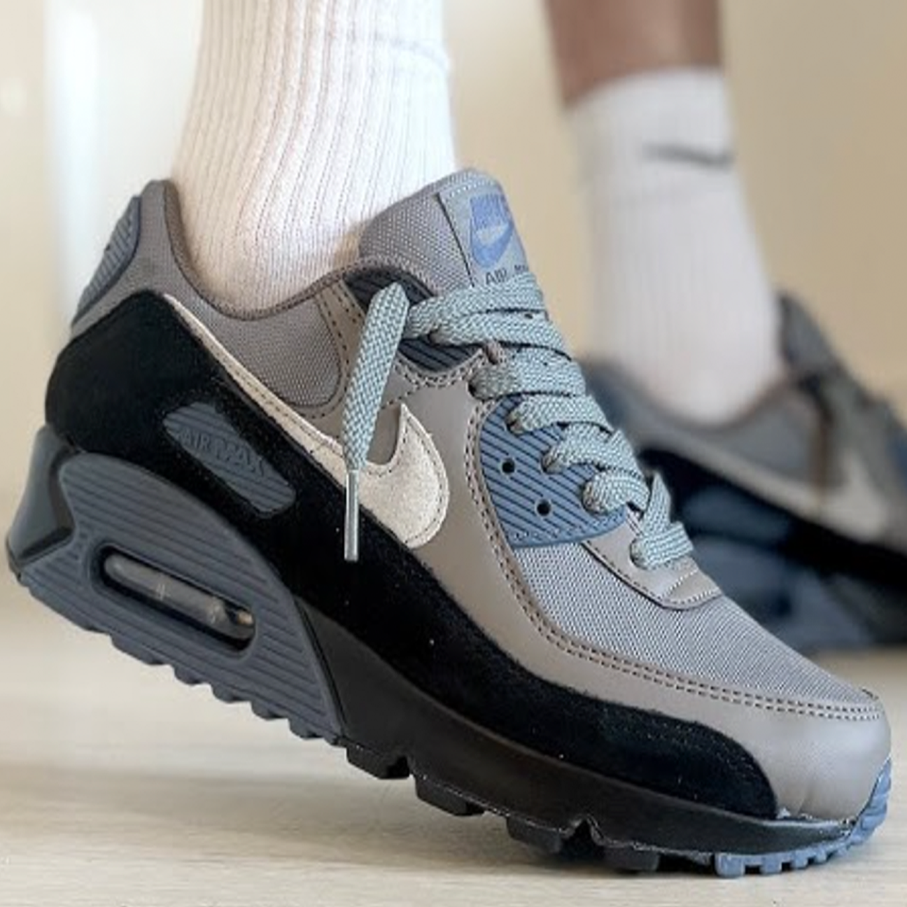 Nike Air Max 90 Smoke Grey Diffused Blue sneaker with grey mesh upper blue accents and Air Max cushioning available at The Attic
