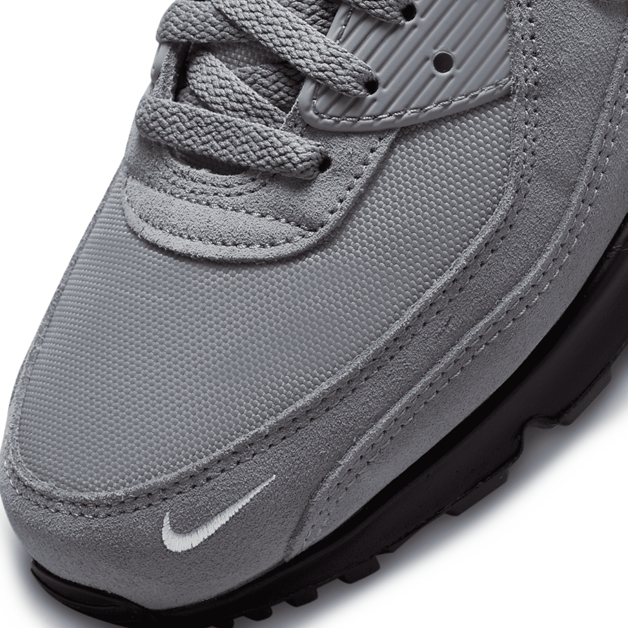 Nike Air Max 90 Smoke Grey Light Photo Blue sneaker with mesh and leather upper blue accents and classic Air Max cushioning available at The Attic